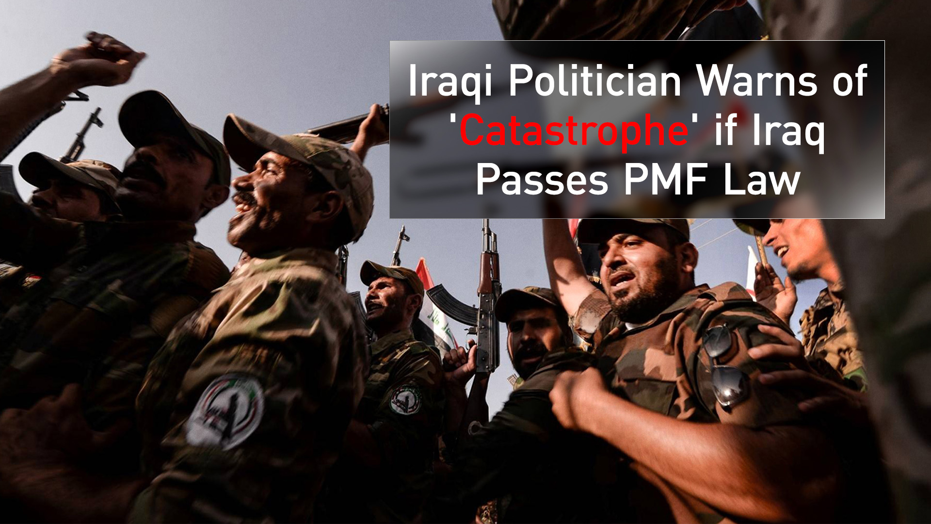 The photo shows members of Iraq's Popular Mobilization Forces (PMF) marching in Hatra District, Nineveh Plains, June 22, 2023. (AFP)