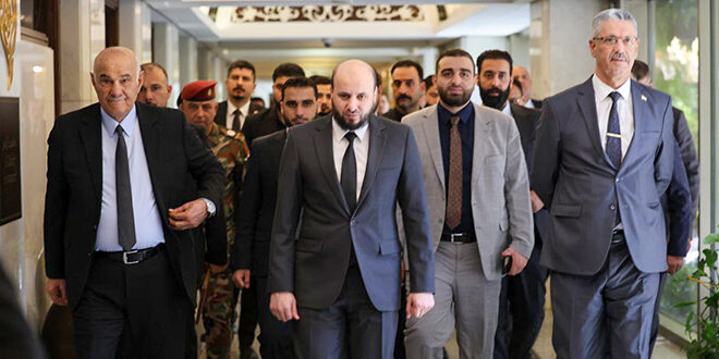 Iraqi Minister of Water Resources Aoun Diab Abdullah (left) walking with Syrian Minister of Energy Mohammed al-Bashir (middle), Aug. 12, 2025. (Photo: SANA)