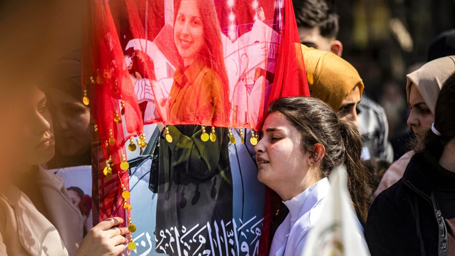 A woman reacts next to one of the pictures of victims of a recent wave of sectarian violence targeting Syria's Alawite minority. (Photo: AFP)