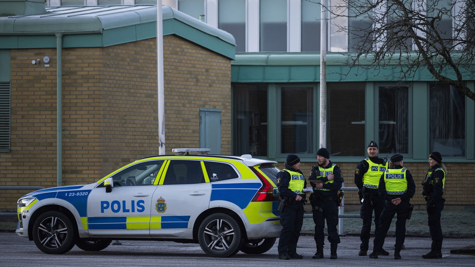 Police officers stand guard outside an adult education center in Orebro, Sweden, on Feb. 6, 2025. (AFP)