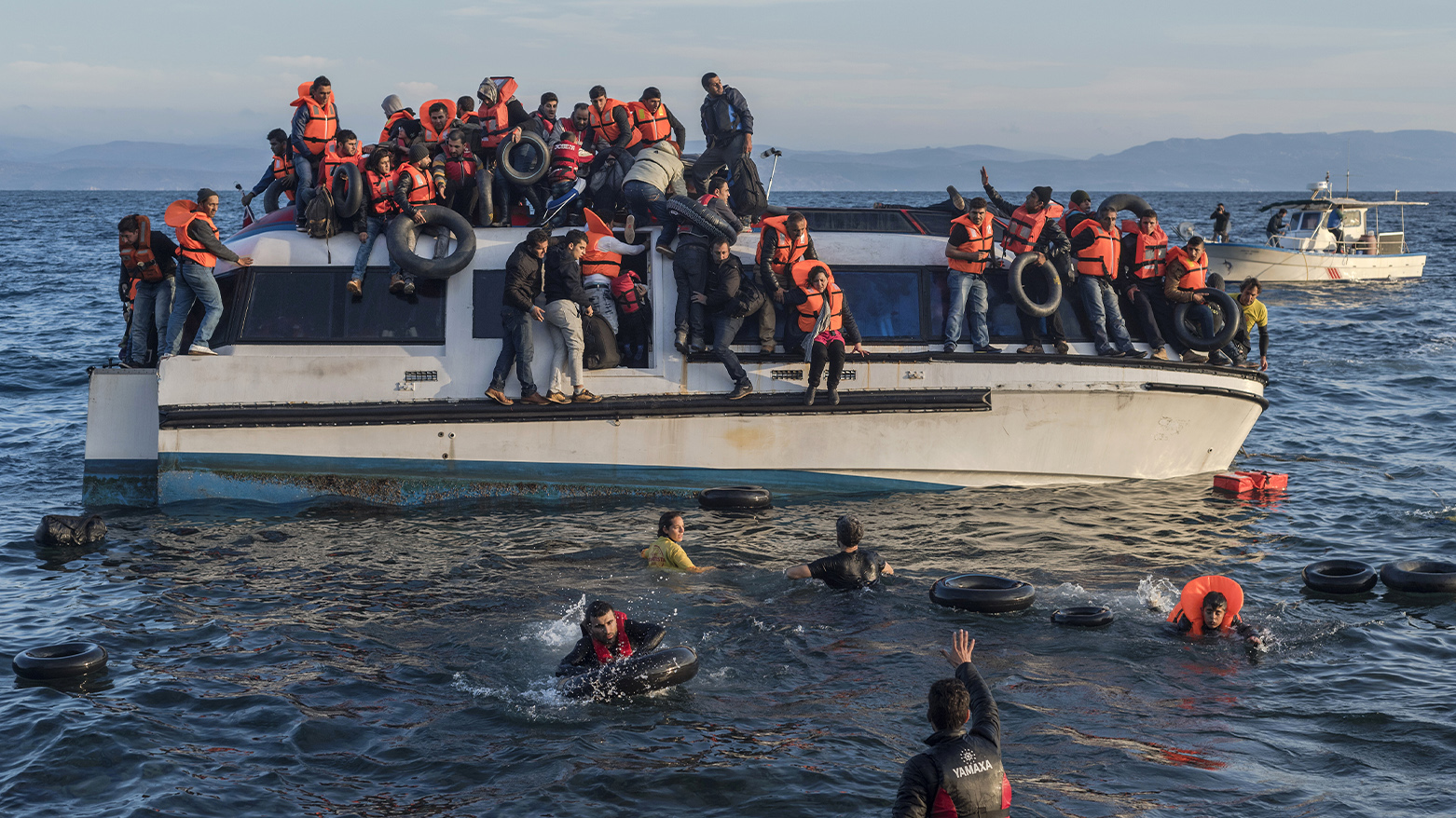 Refugees are seen aboard a boat in Greek waters. (Photo: Archive)