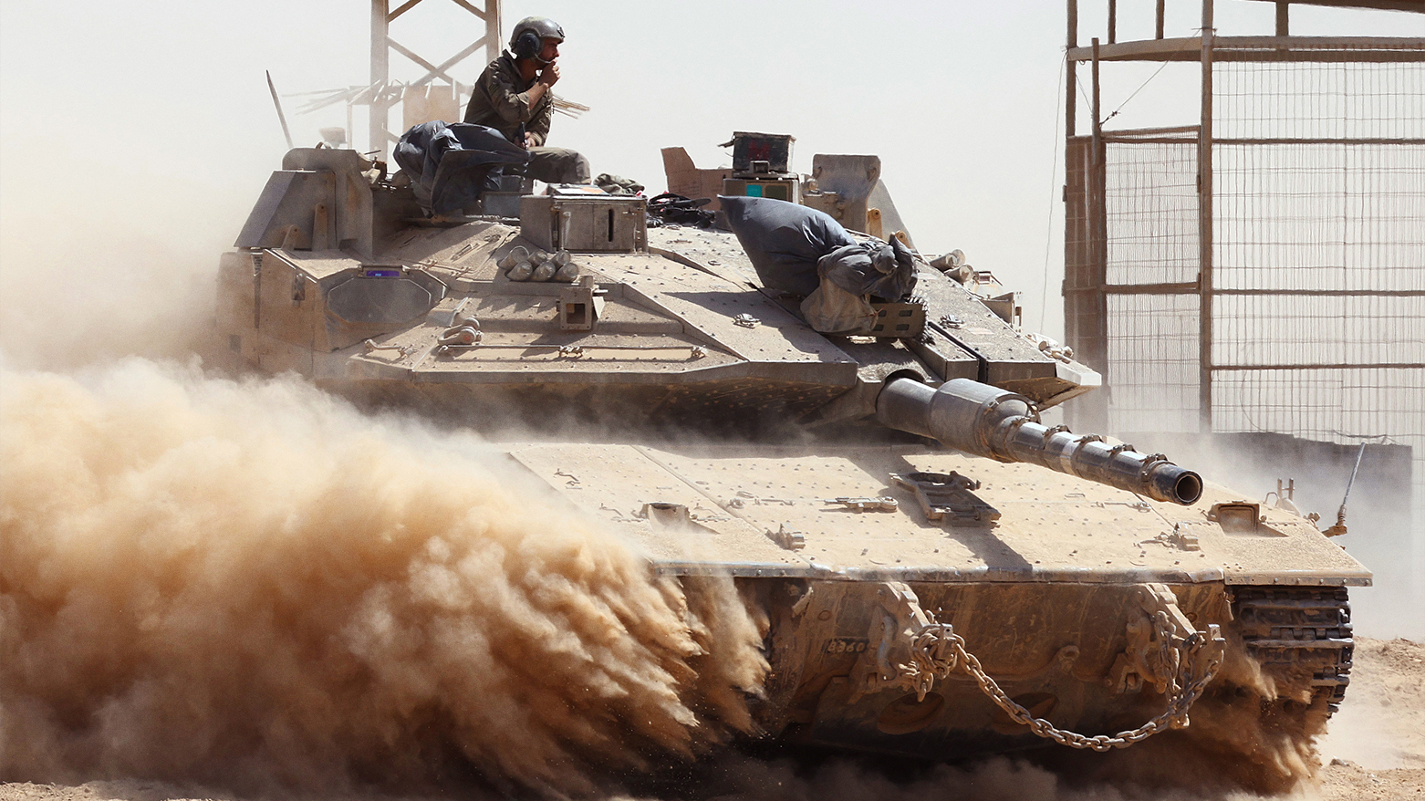 Israeli troops drive a tank near Israel's border fence with the Gaza Strip on Aug. 19, 2025. (AFP)