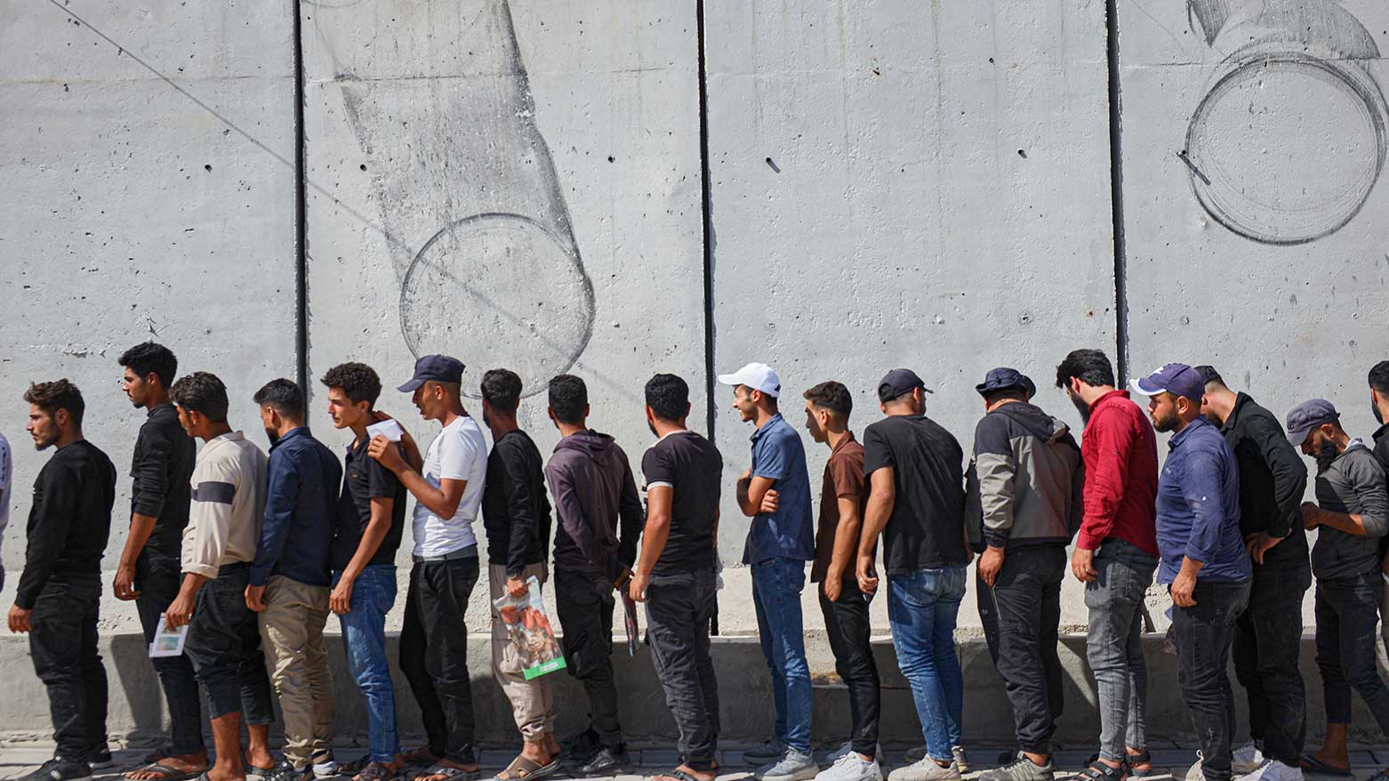 Young Kurdish men line up to sign up to join Syrian government's General Security forces at a police station in Afrin, Syria, Aug. 21, 2025. (Photo: AP)