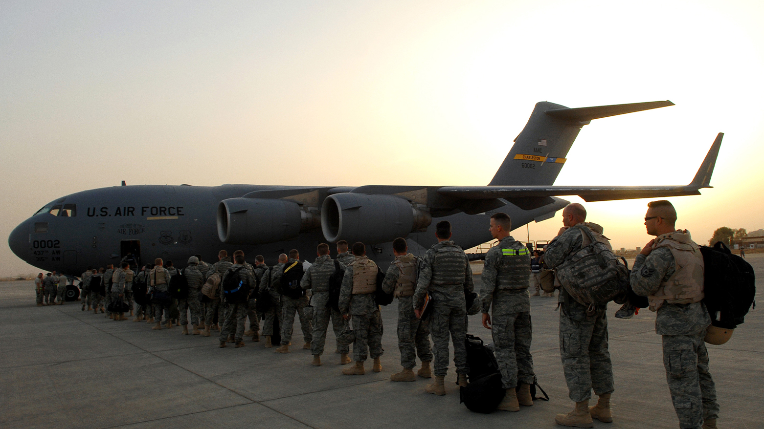 U.S. airmen of the 332nd Air Expeditionary Wing board a C-17 Globemaster III at Balad Air Base, Iraq, May 21, 2008. (Photo: DVIDS)