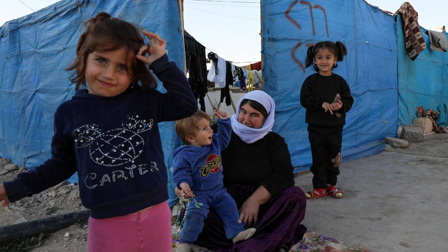 Displaced Yazidi Kurds are seen at an IDP camp in Khanke. (AFP)