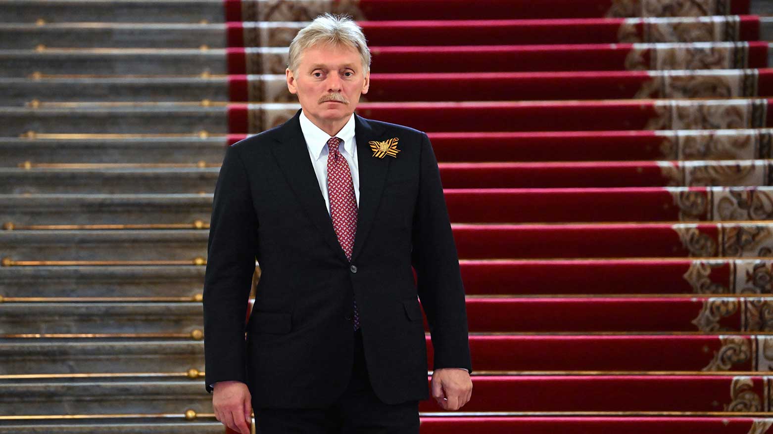 Kremlin spokesman Dmitry Peskov walks down stairs at the Kremlin in Moscow, Russia, May 9, 2024. (Photo: AP)