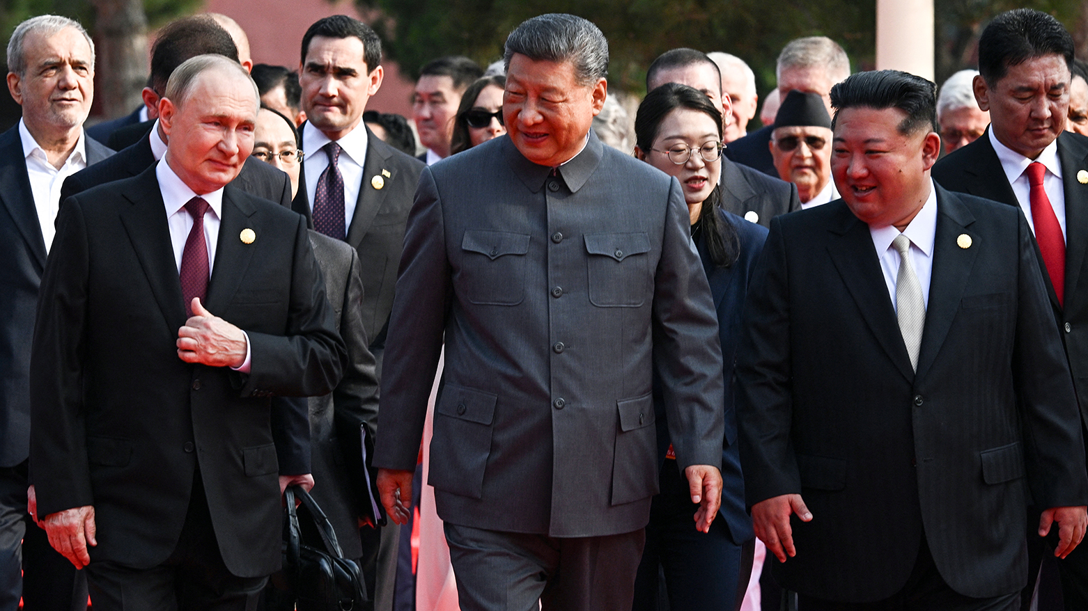 (L-R) Russia's President Vladimir Putin walks with China's President Xi Jinping and North Korea's leader Kim Jong Un, and behind them on the left is Iranian president Masoud Pezeshkian. (AFP)