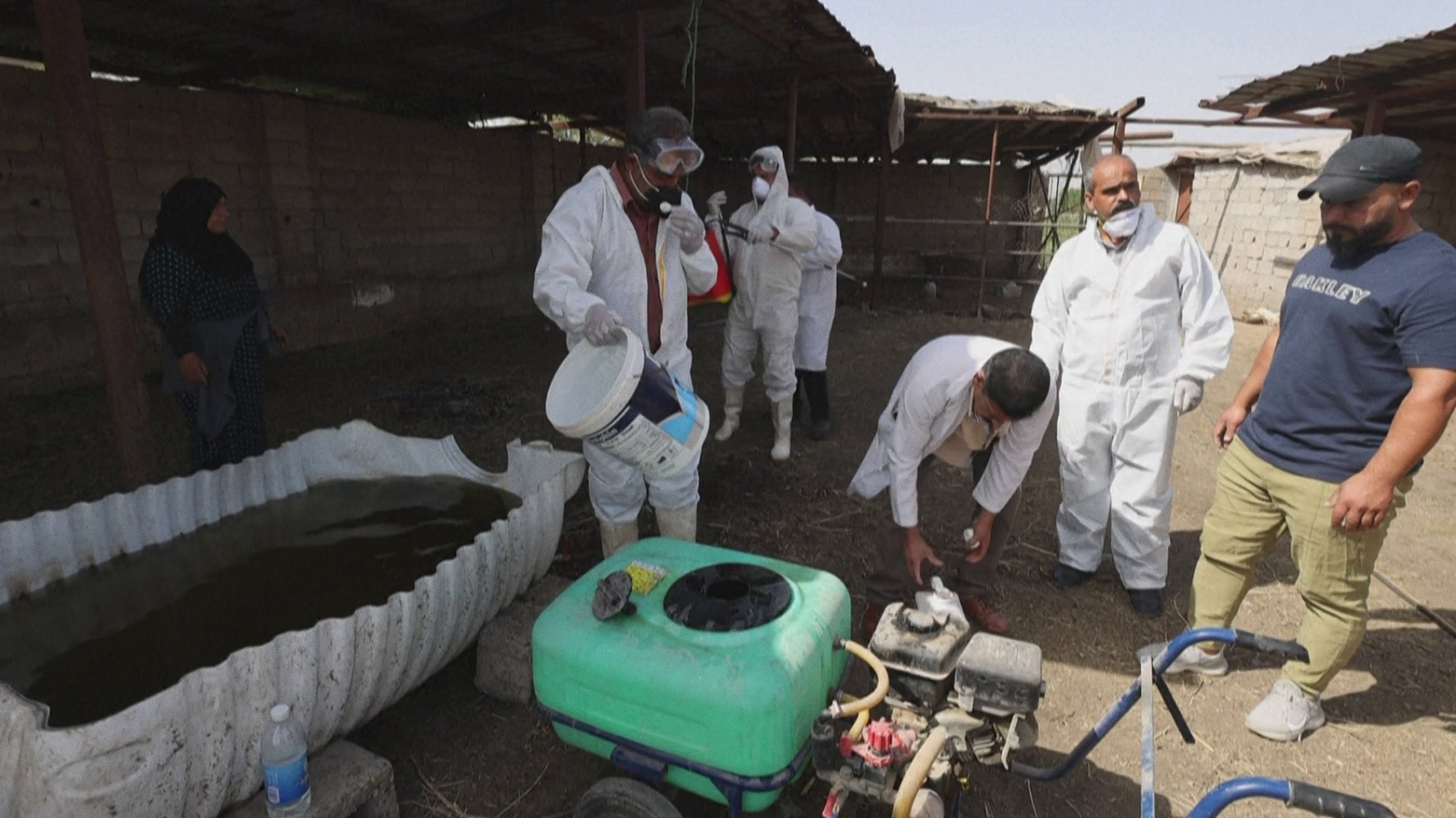 A medical team from Iraq's Health Ministry, carries out a disinfection campaign. (Photo: AFP)