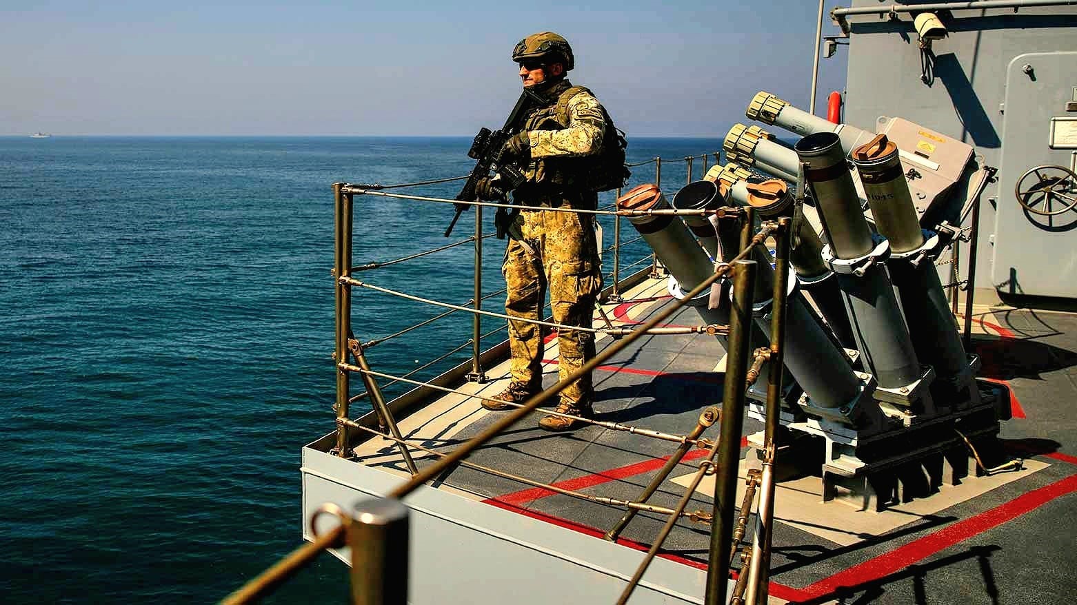 A Turkish army soldier stands guard on one of two military ships sailing in the Mediterranean Sea, heading from the port of Mersin, Turkey, to the port of Beirut, Oct. 9, 2024. (Photo: AP)