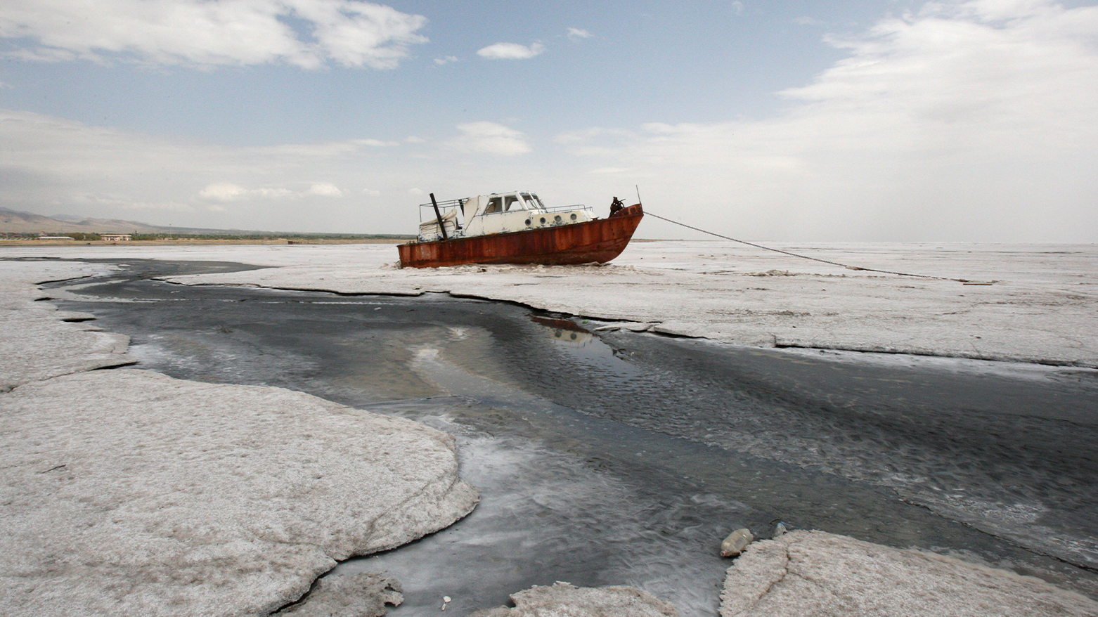 An abandoned boat stranded in the salt flats of Lake Urmia. (AP)