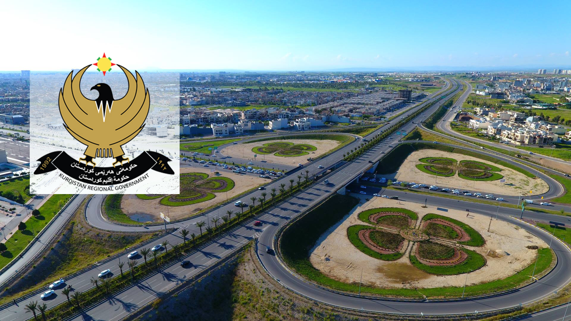 An aerial view of Erbil’s 120-Meter Ring Road with the KRG logo. (Graphics: Kurdistan24)