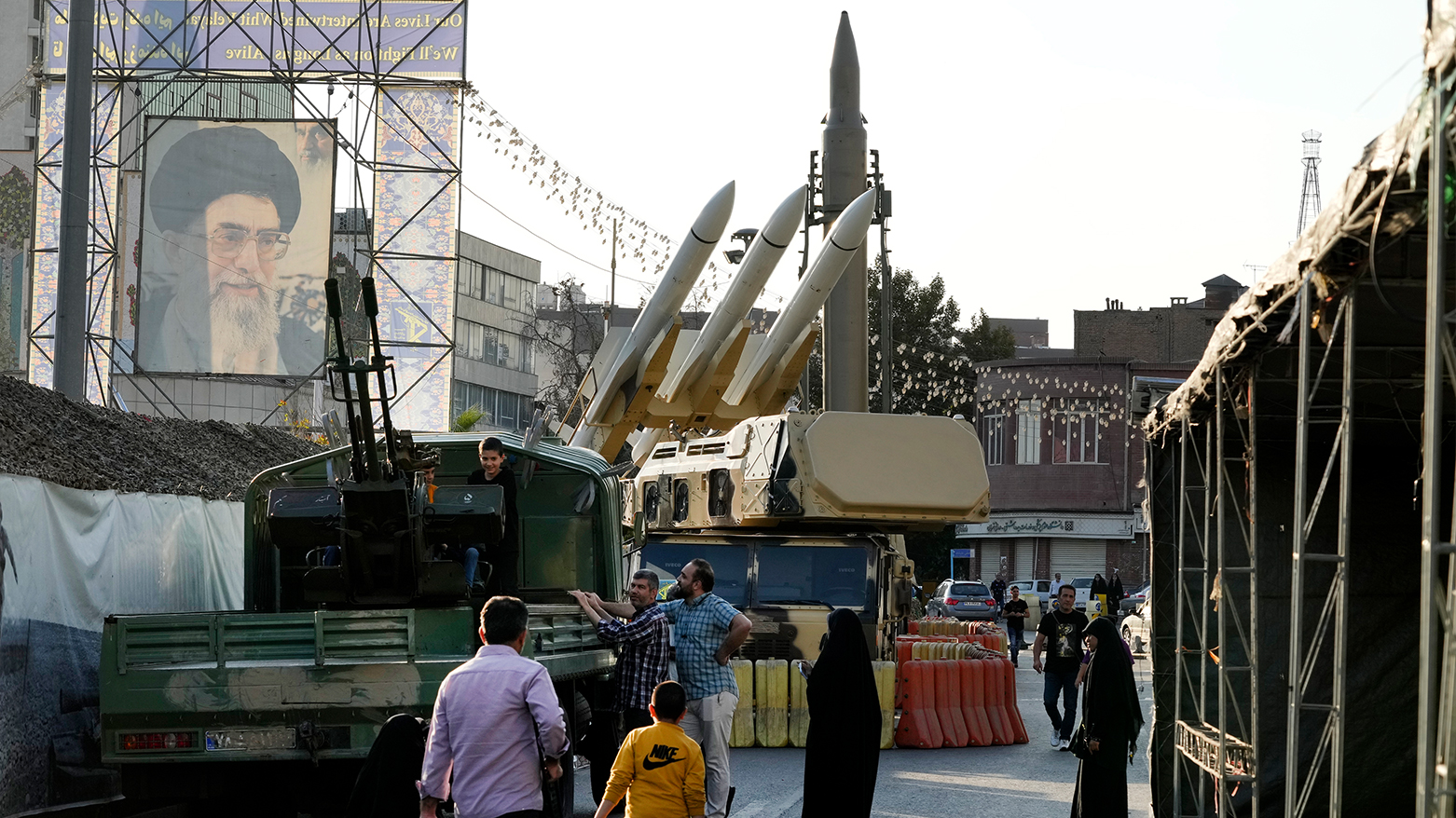 Iranians visit a military exhibition marking ‘Sacred Defense Week’ in Tehran, Sept. 29, 2023. (AP)
