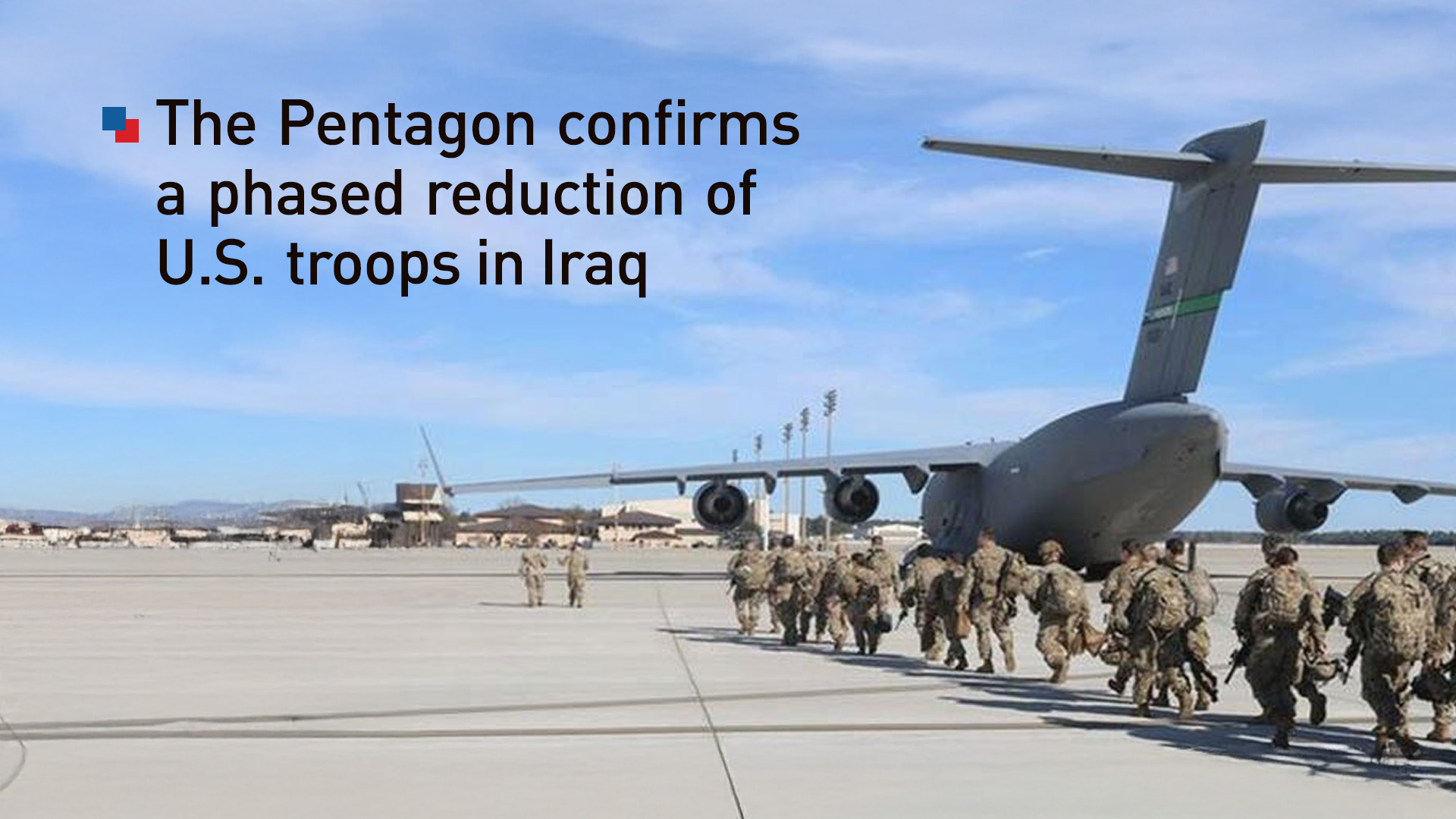 A group of U.S. military forces head to a troop transport plane. (Graphic: Kurdistan24)