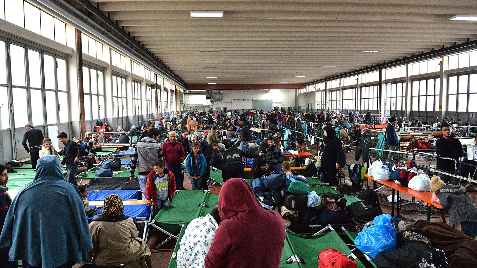 Refugees wait in a crowded migrant registration center in Passau, southern Germany, Oct. 8, 2015. (Photo: AP)