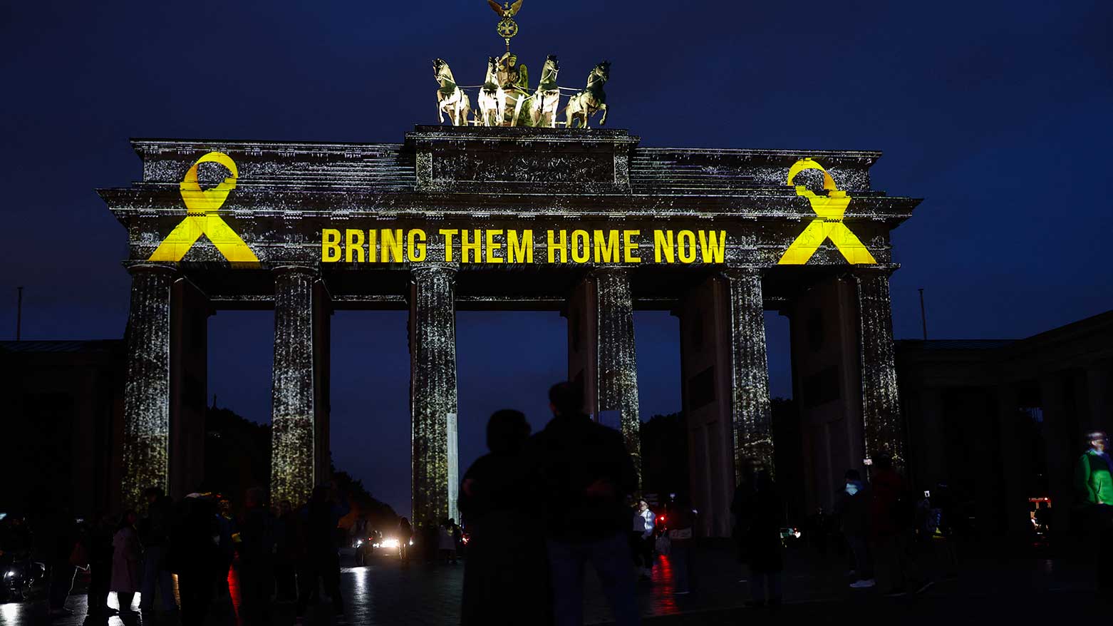 Berlin’s iconic Brandenburg Gate is illuminated with the message “Bring them home now” on Oct. 7, 2025, marking the second anniversary of the Hamas-led assault on Israel. (Photo: AFP)