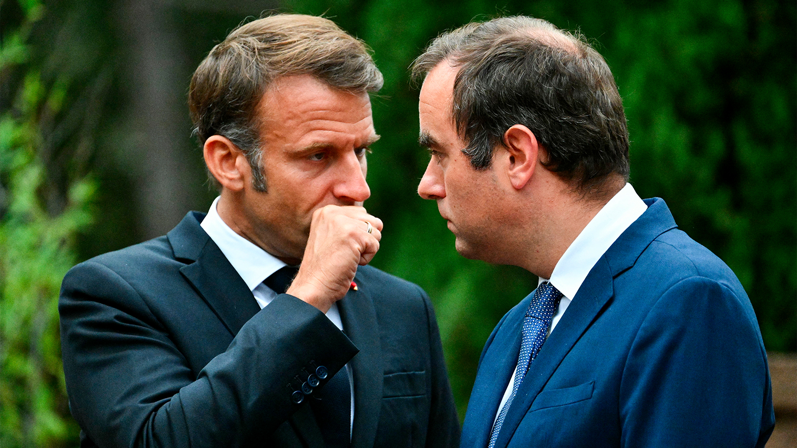 France's President Emmanuel Macron (L) speaks with France's PM Sebastien Lecornu (R). (AFP)