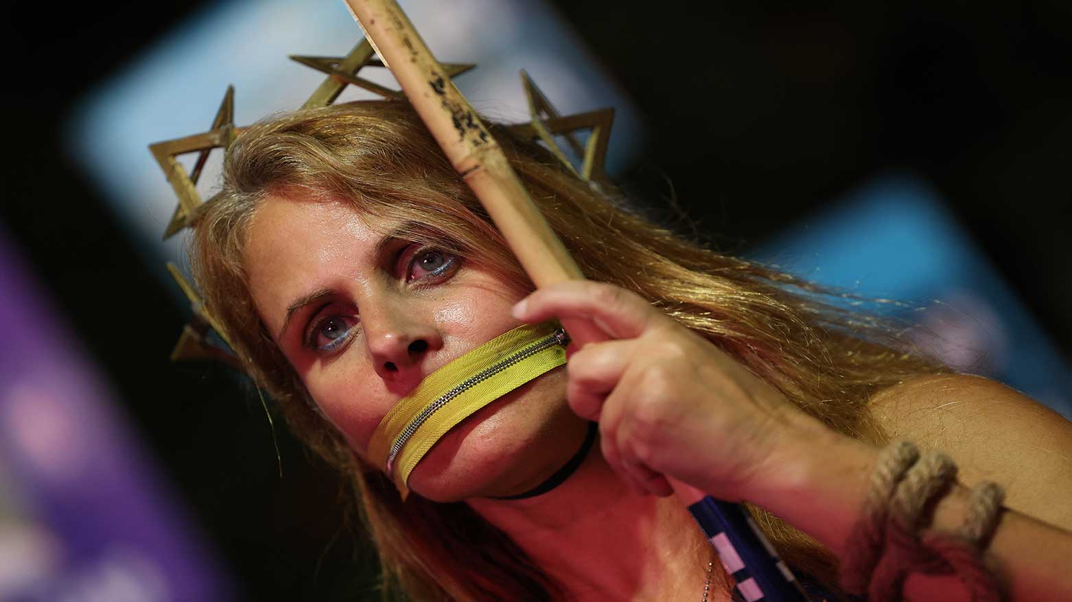 A woman stands with a symbolic zipper around her mouth during a demonstration at Hostage Square in Tel Aviv, Israel, as people call for the release of all the bodies of hostages held in Gaza by Hamas, Oct. 25, 2025. (Photo: AFP)