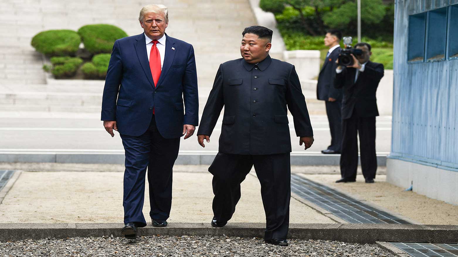 North Korea's leader Kim Jong Un (R) and US President Donald Trump cross south of the Military Demarcation Line that divides North and South Korea, June 30, 2019. (Photo: AFP)