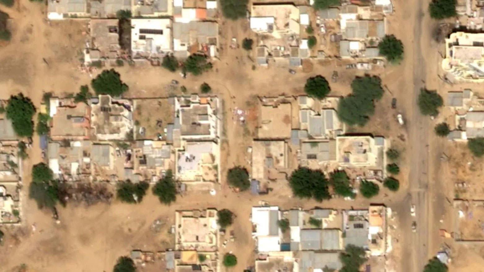 This satellite image taken by an Airbus DS shows  bodies on the ground near what are likely Rapid Support Forces vehicles in the First Class neighborhood of El Fasher. (AP)