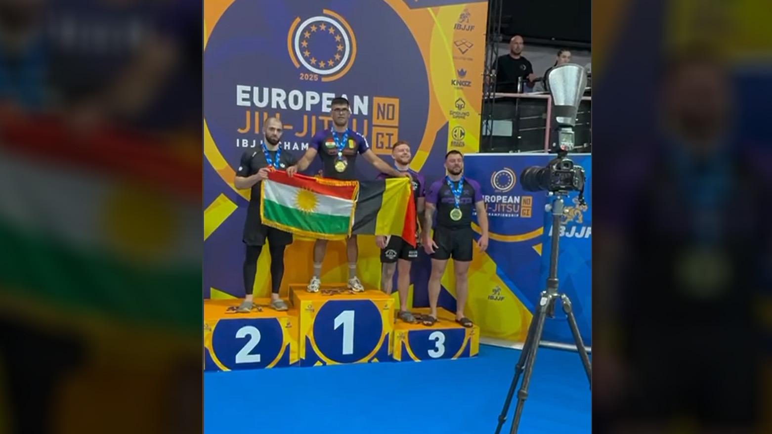 Kurdish athlete Farshad Gerdkane, holding Kurdistan and Belgium flag. (Photo: Kurdistan24)