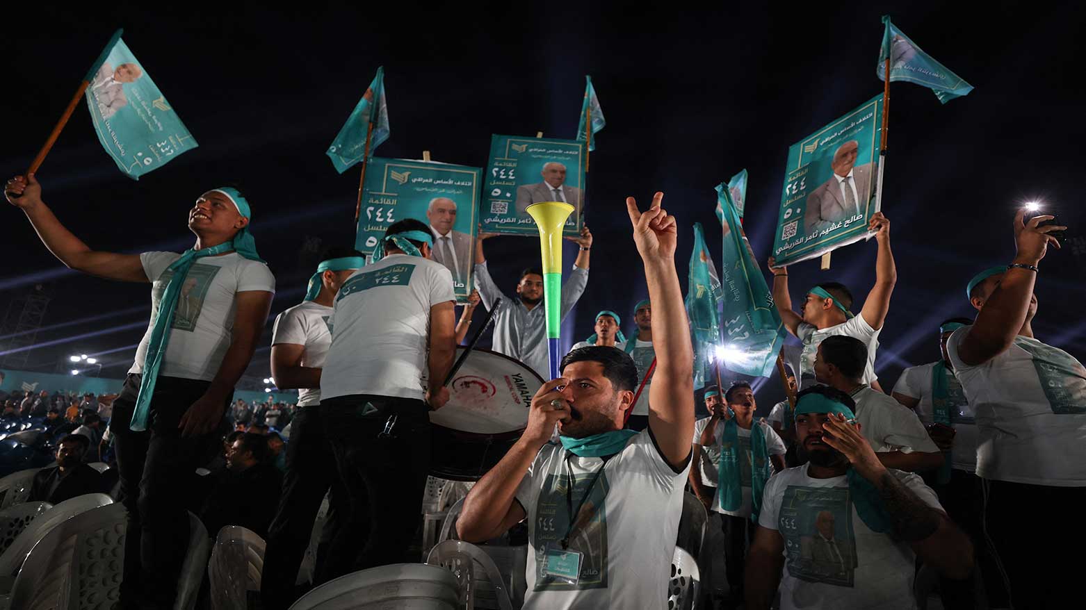 Iraqis hold up placards of their candidate during a campaign rally by the Iraqi Foundation Coalition ahead of the country's parliamentary elections in Baghdad on November 1, 2025. (Photo: AFP)