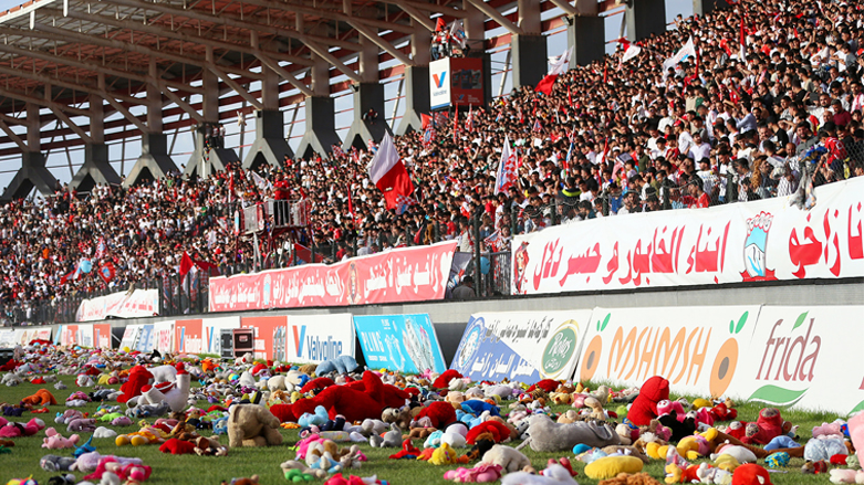 Zakho SC fans throwing the teddy bears onto the pitch in support of cancer patients. (Photo: Kurdistan24)