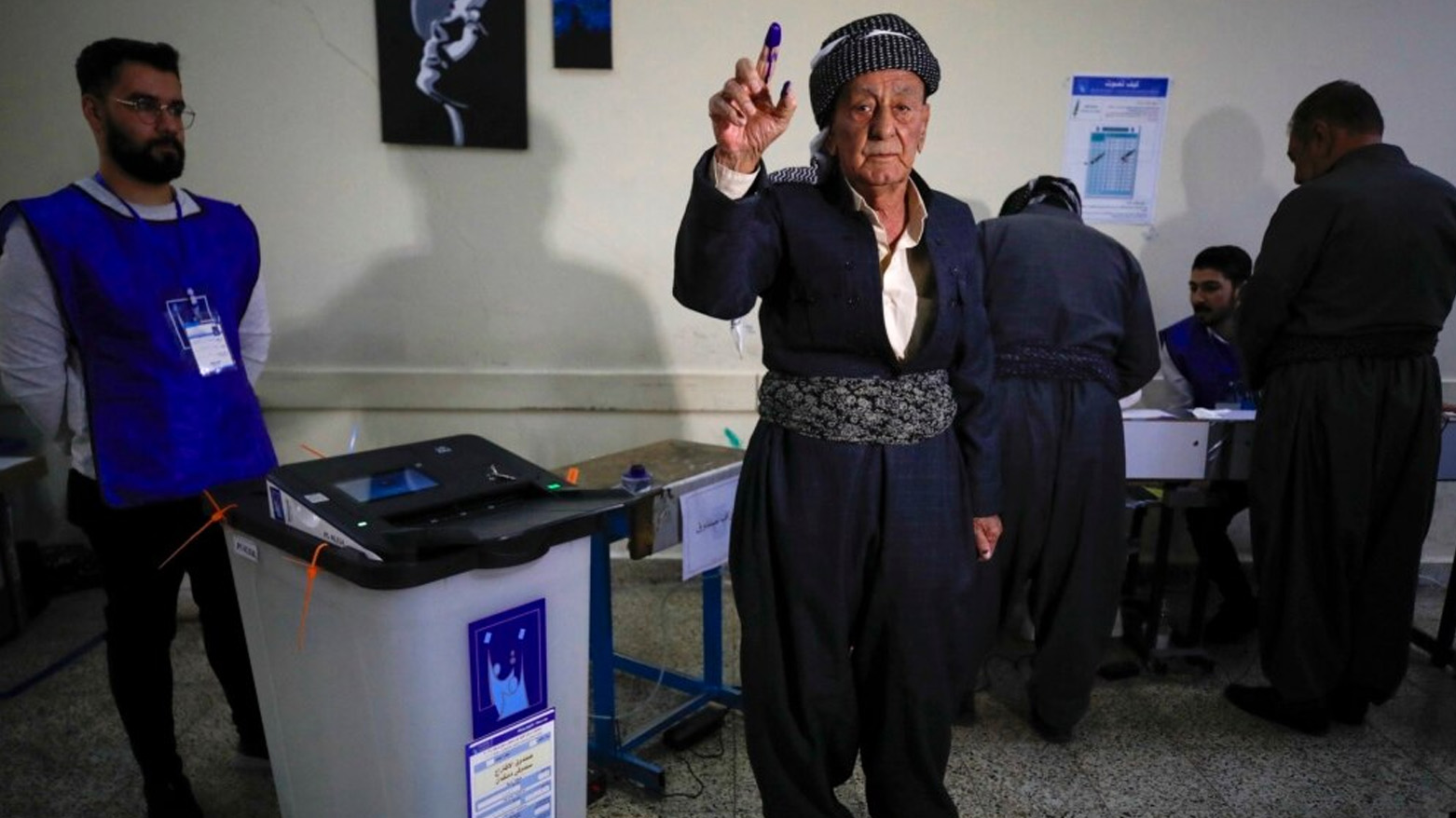 A Kurdish voter displays his ink-stained finger after casting his vote in the Kurdistan Region. (AFP)