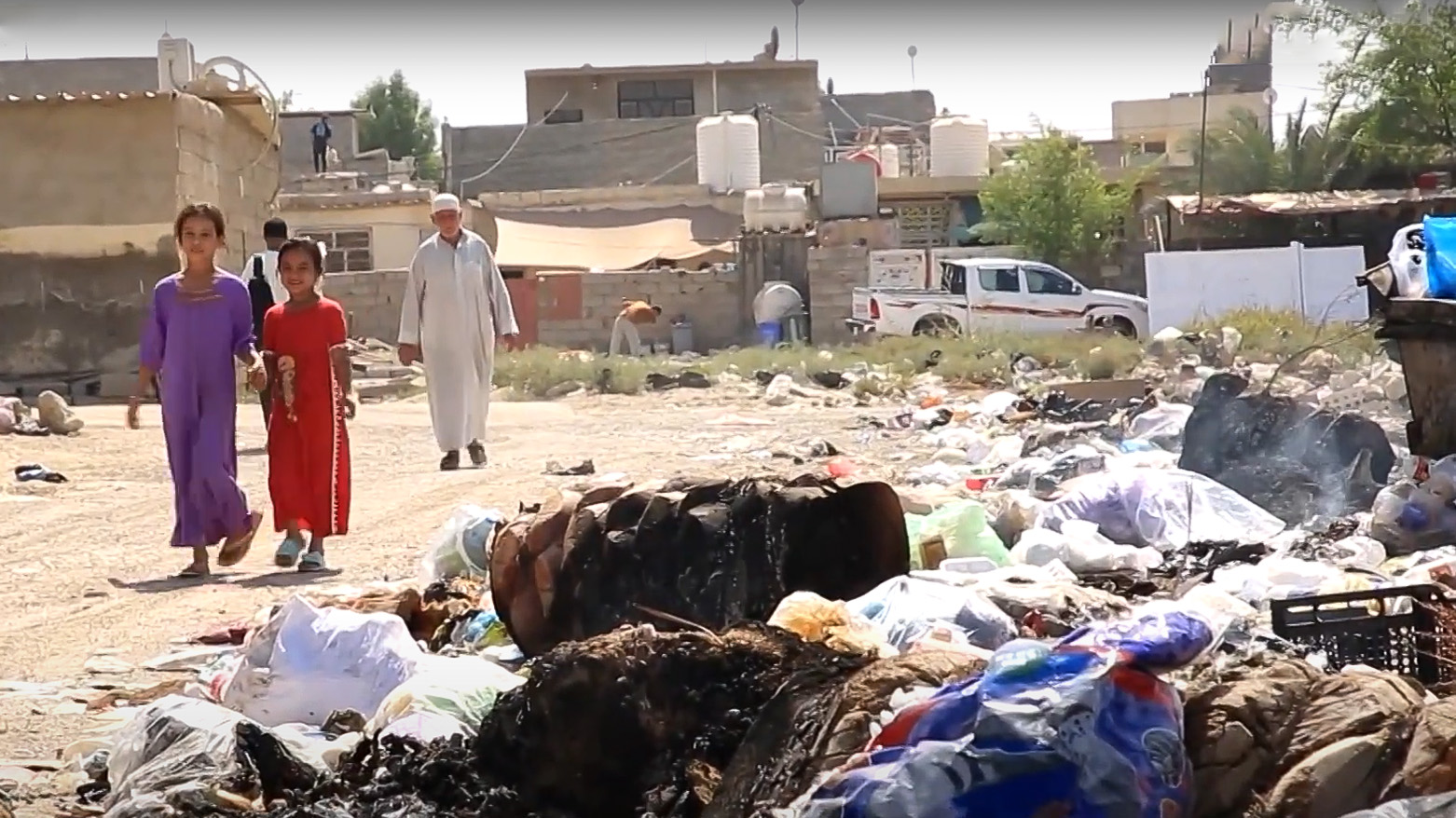 A pile of burnt waste on the edge of a road in a neighborhood of Tikrit. (Photo: Kurdistan24)
