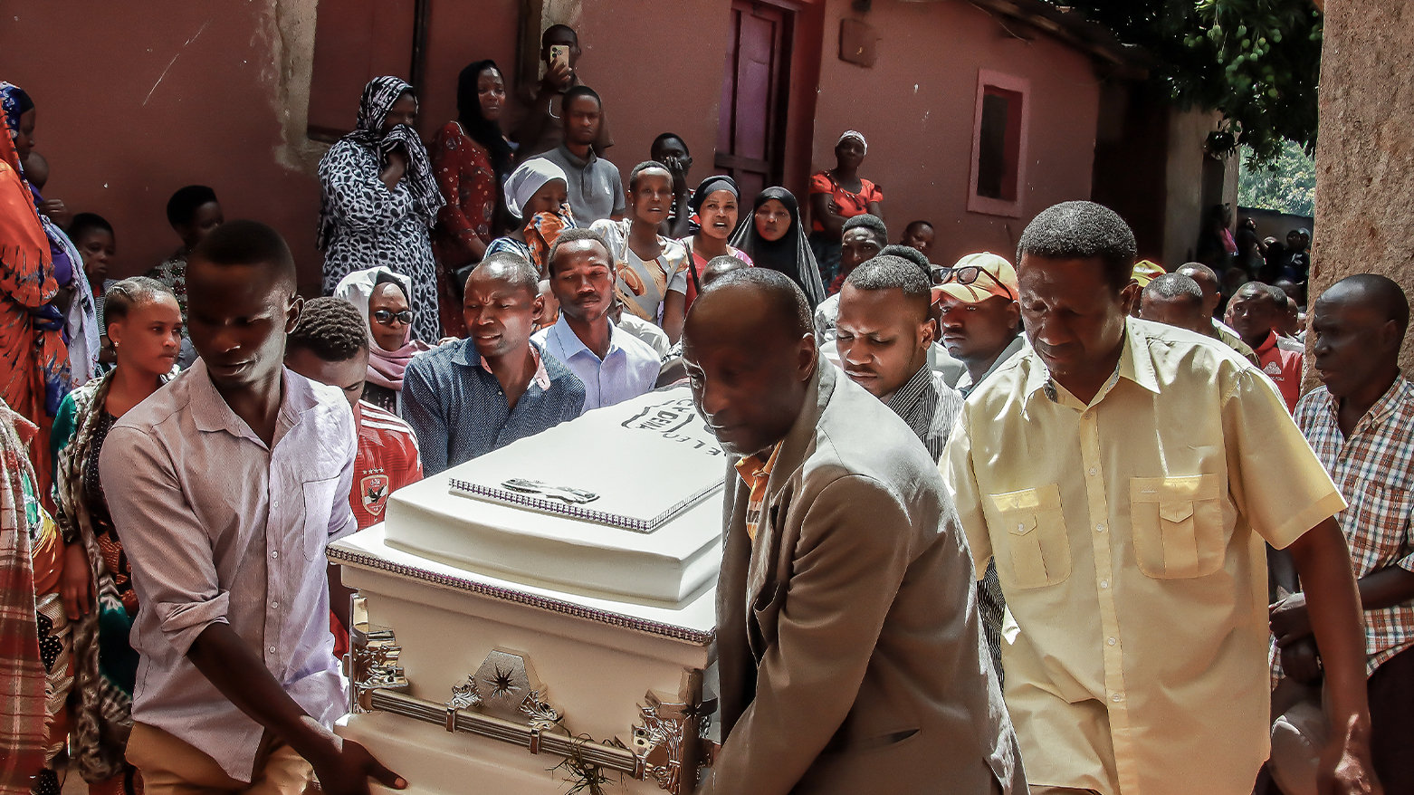 Mourners carry the coffin of Chadema youth leader Michael Christian in Mwanza. (AFP)