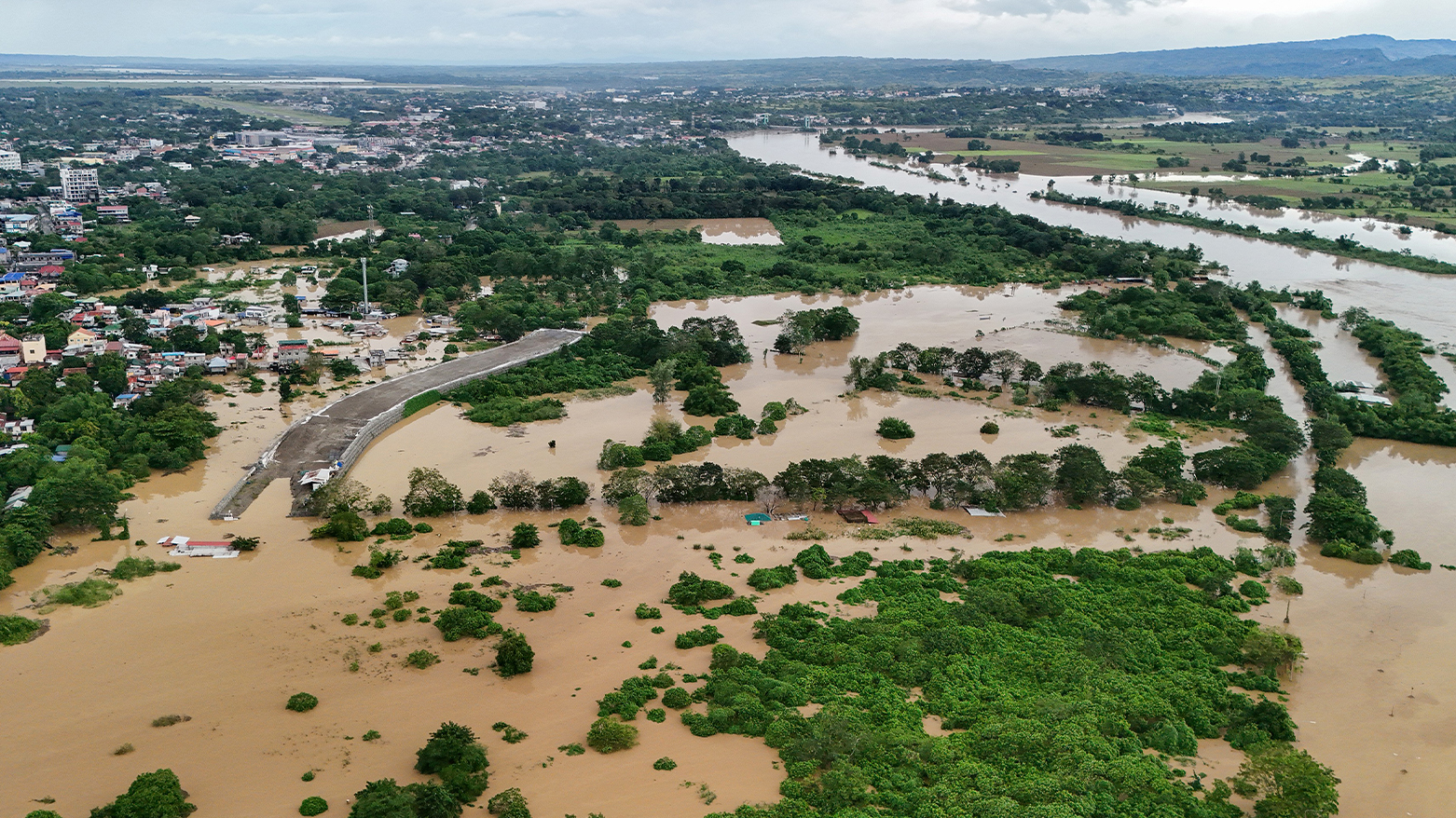 An aerial view of flooded houses and rice fields in Tuguegarao City, Cagayan province, north of Manila on Nov. 10, 2025. (AFP)