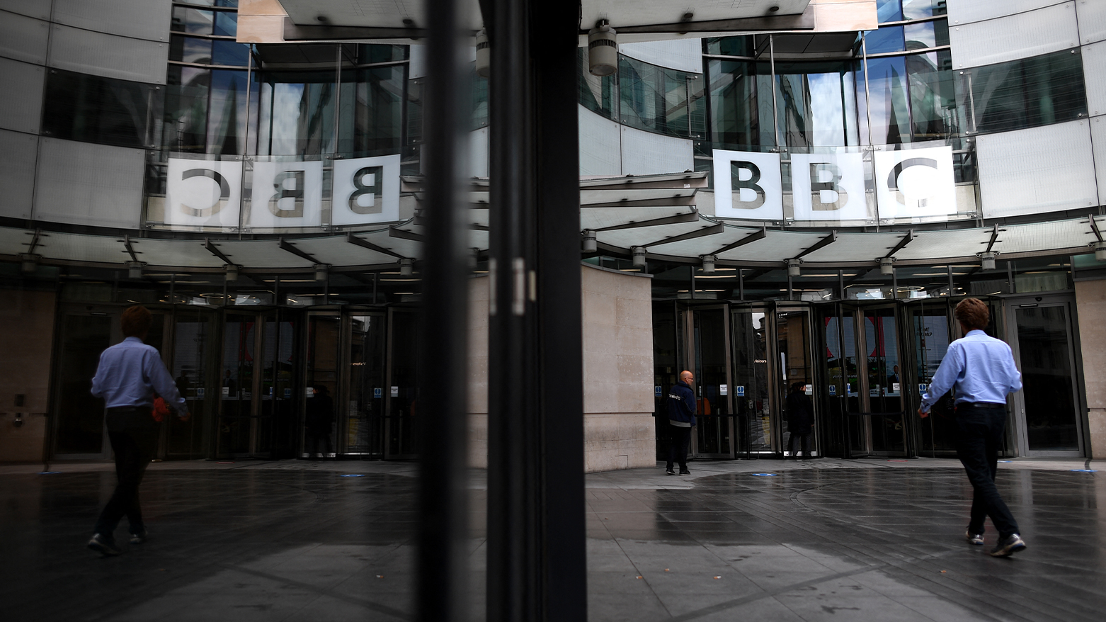 A man walks outside the BBC headquarters in Portland Place, London on July 2, 2020. (AFP)