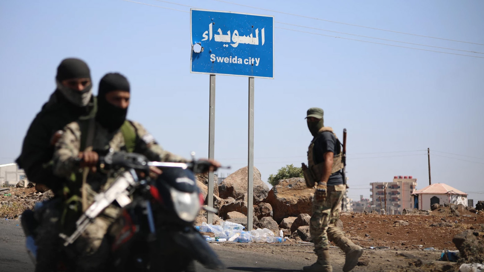 Tribal and bedouin fighters deploy in the western neighbourhood of southern Syria's predominantly Druze city of Sweida, (AFP)
