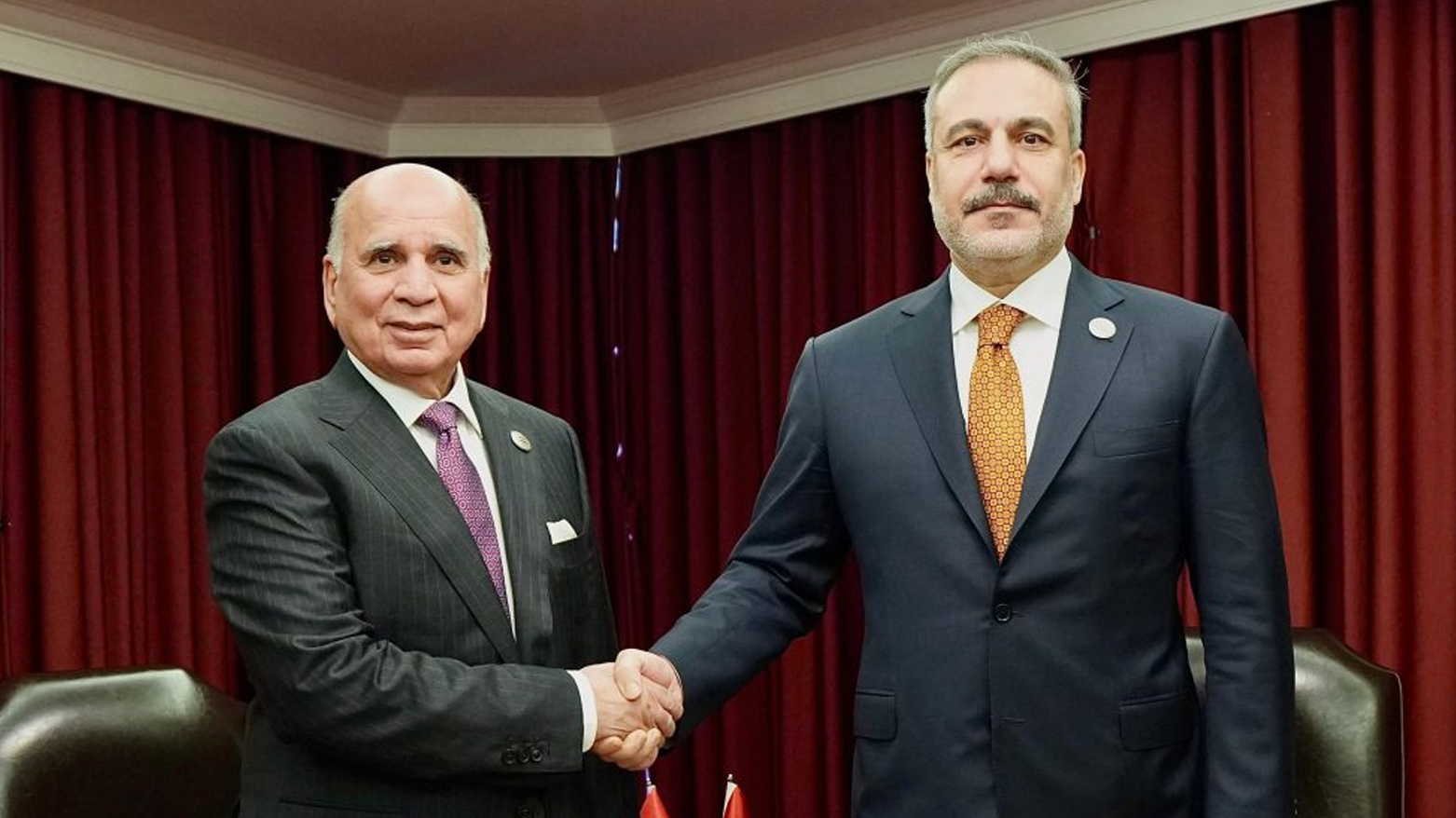 Iraqi Deputy Prime Minister and Foreign Minister Fuad Hussein (left) shaking hands with Turkish Foreign Minister Hakan Fidan, Dec. 7, 2025. (Photo: Iraqi Foreign Ministry)