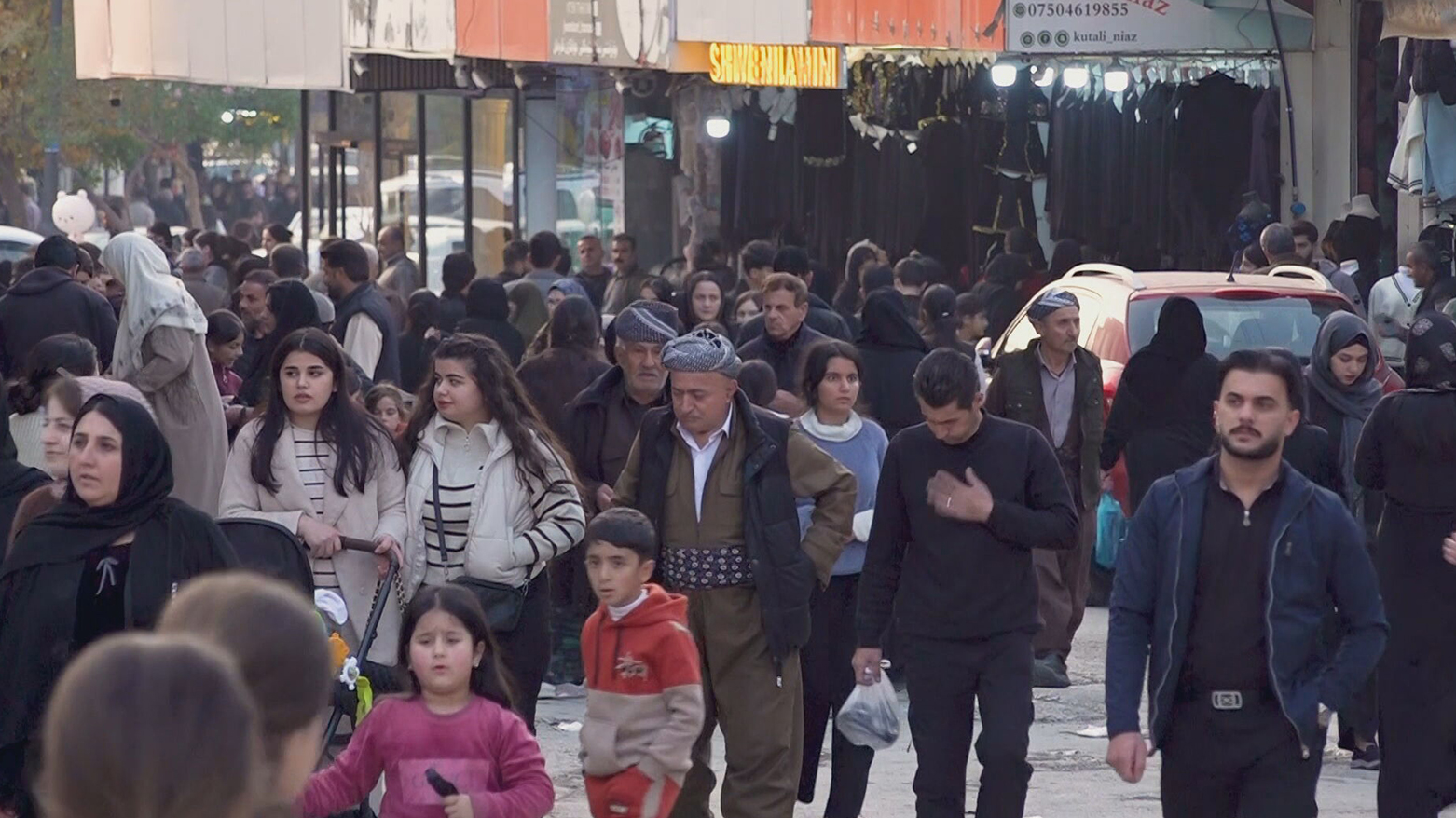 Soran residents walk in the marketplace. (Photo: Kurdistan24)