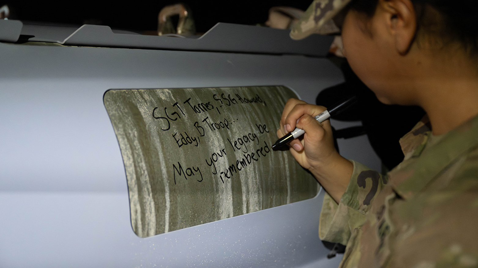 US soldier with Iowa National Guard signs GBU-31 munitions in CENTCOM area. (AFP/U.S. Air Force)