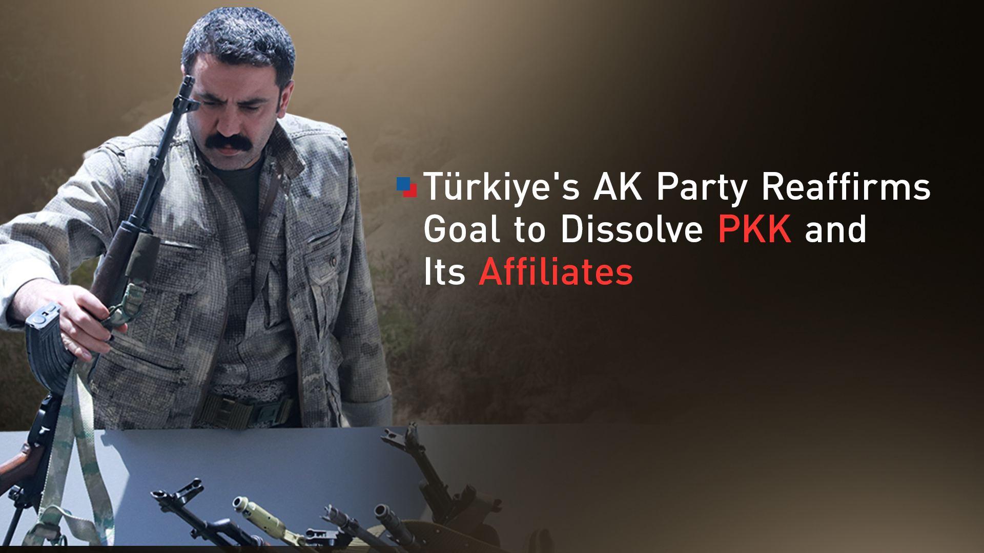 A PKK fighter places his weapon on a pile to be burned during a disarmament ceremony. (Graphics: Kurdistan24)