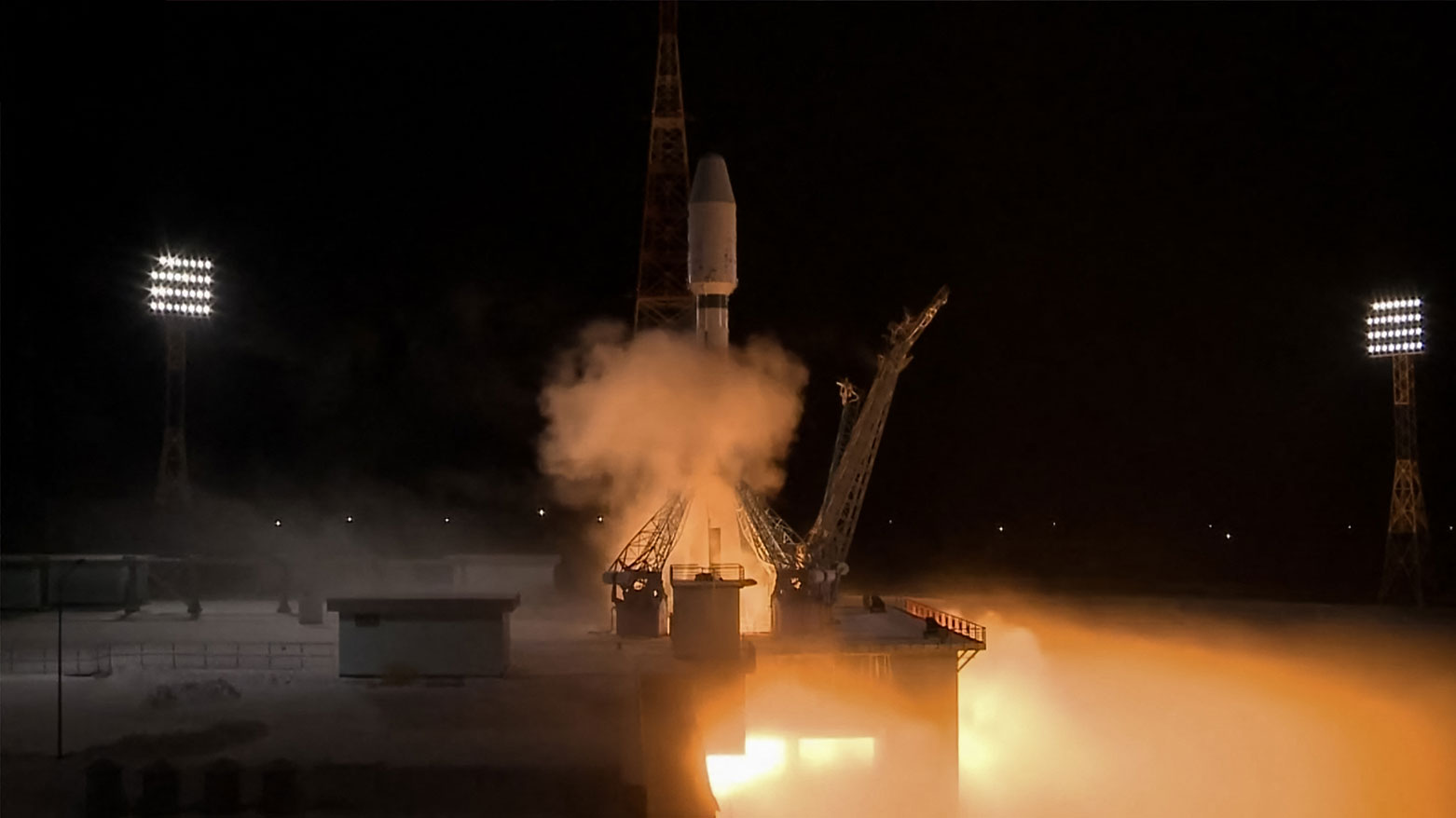 In this grab from a live broadcast run by the Russian space agency, a Soyuz-2.1b rocket booster with a number of satellites blasts outside the city of Uglegorsk, Russia. (AFP)