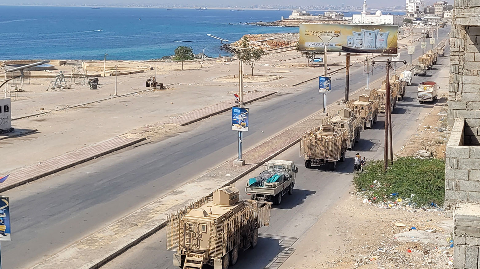 A convoy of armoured vehicles makes its way along a street in the port city Mukalla, southern Yemen, on January 1, 2026. (Photo: AFP)