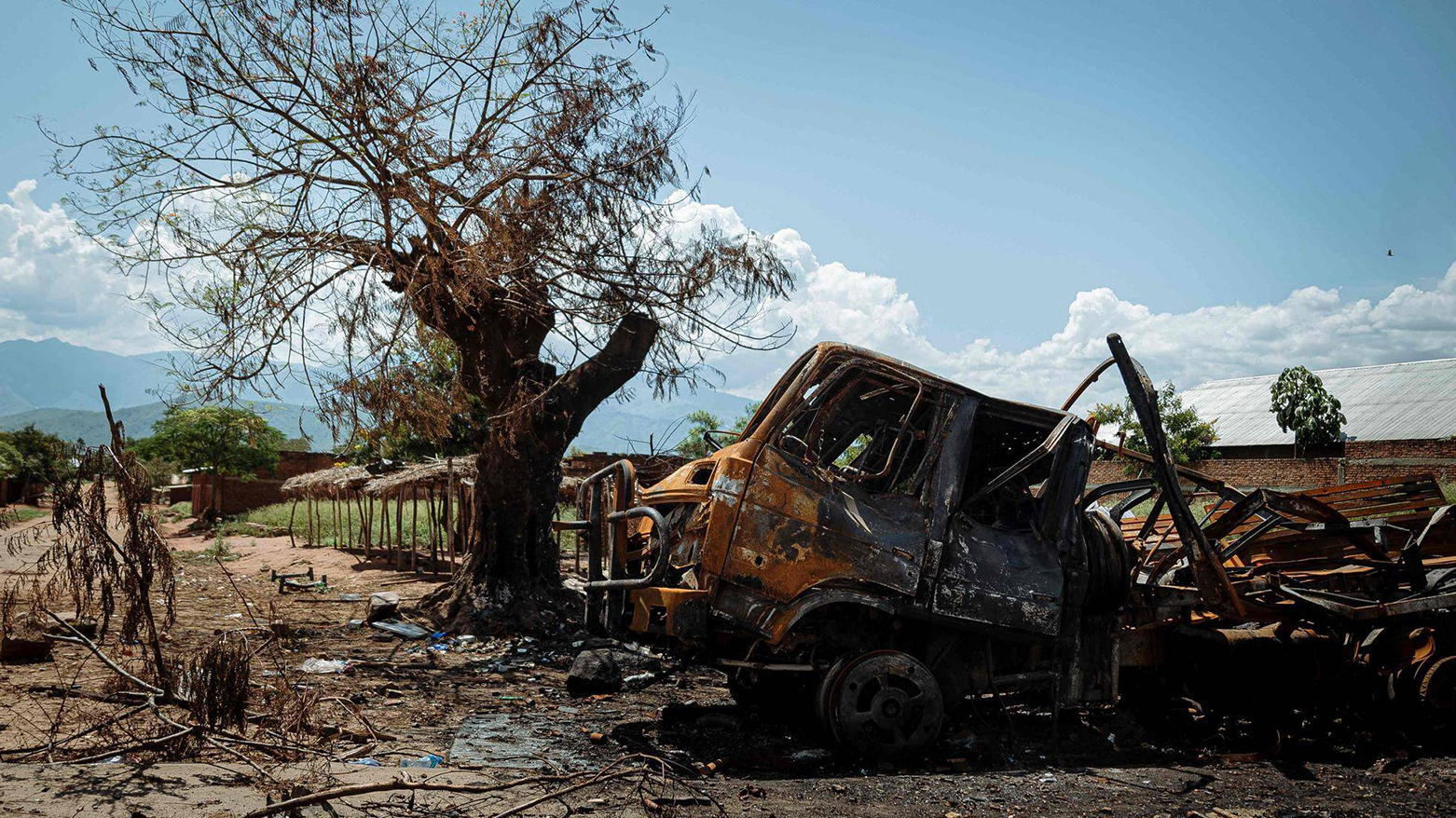 A charred military vehicle belonging to the Armed Forces of the Democratic Republic of Congo (FARDC) is left on the side of the road in Luvungi on Dec. 13, 2025. (AFP)