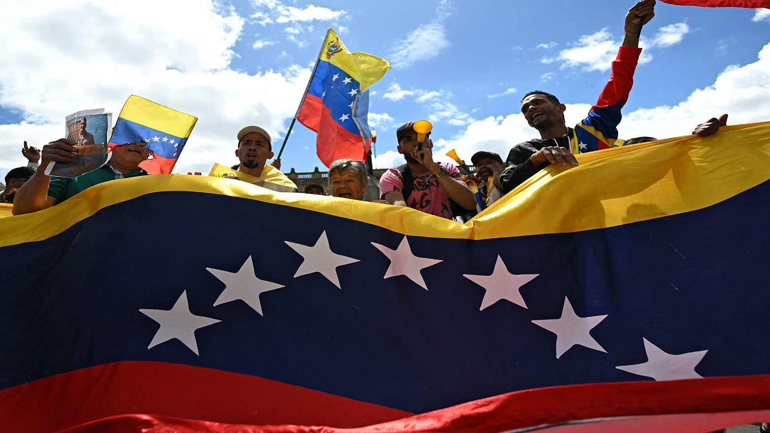 People celebrate at the Bolivar square in Bogota on Jan. 3, 2026, after US forces captured Venezuelan leader Nicolas Maduro. (AFP)