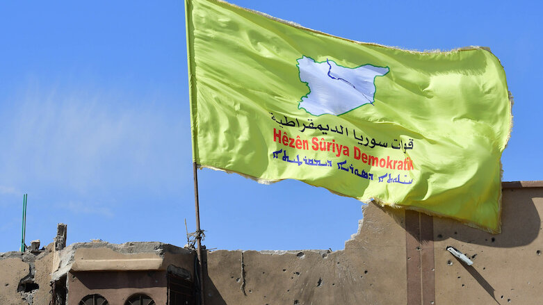 A banner of the Syrian Democratic Forces (SDF) is flown in Western Kurdistan. (Photo: AFP)