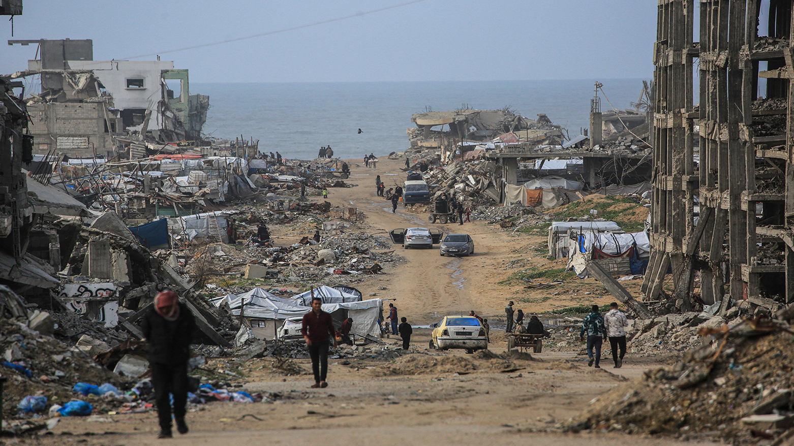 Palestinians walk along a road amid destroyed buildings in Jabalia, in the northern Gaza Strip, Jan. 10, 2026. (Photo: AFP)