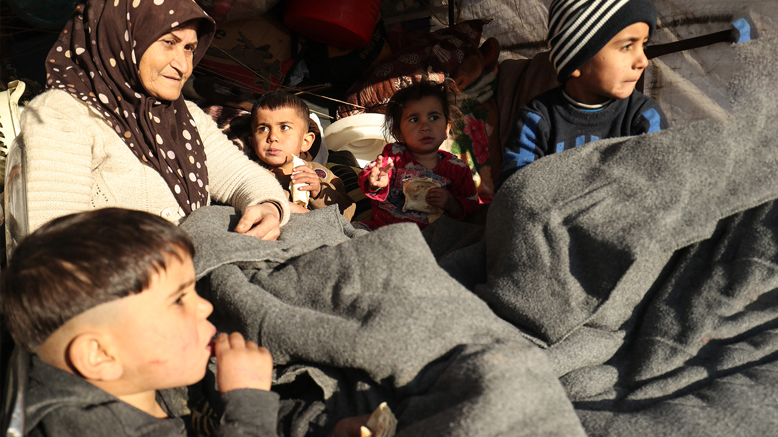 A Kurdish woman and children can be seen in this photo, Jan. 19, 2026. (AFP)