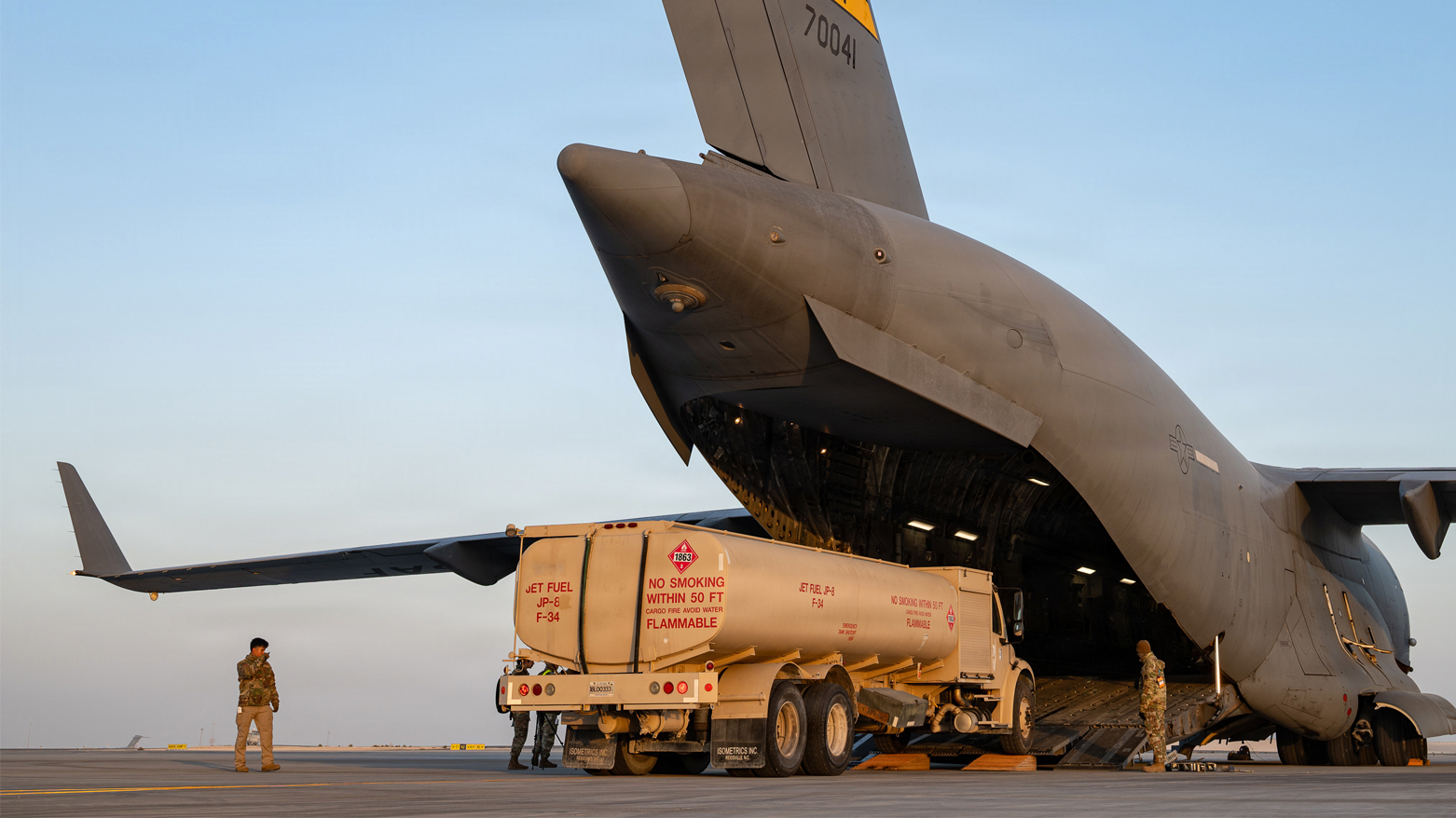 A large military cargo aircraft parked on an airfield. (Photo: CENTCOM)