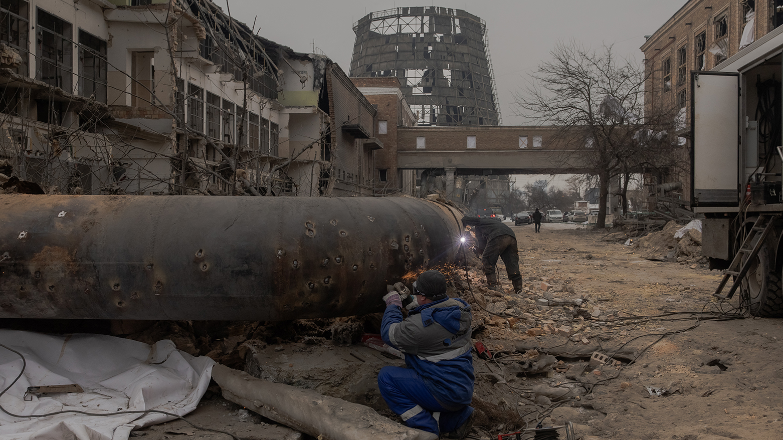 Employees repair sections of the Darnytska combined heat and power plant damaged by Russian air strikes in Kyiv, on Feb. 4, 2026. (AFP)