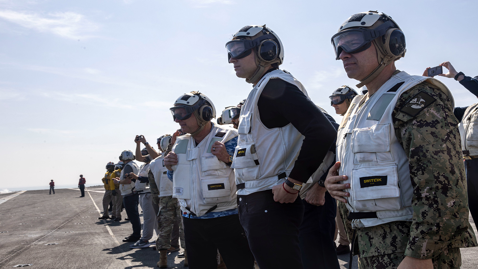 Jared Kushner, 2nd right and Steve Witkoff, 3rd right visit the USS Abraham Lincoln in the Arabian Sea with CENTCOM Commander Adm. Brad Cooper, Feb. 7, 2026. (CENTCOM)