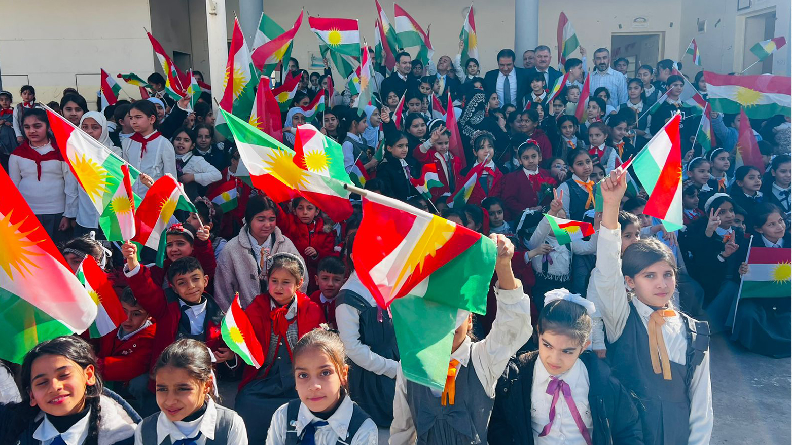 KRG Minister of Education Alan Hama Saeed among schoolchildren and school staff in Kirkuk. (Photo: Kurdistan24)