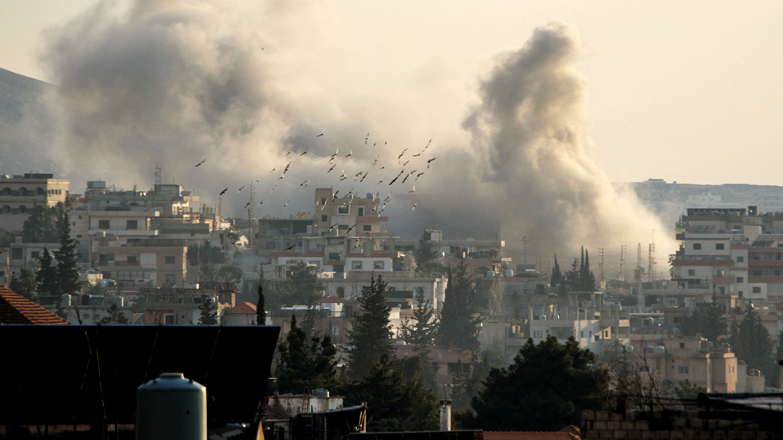 Smoke rises from the site of an Israeli airstrike that targeted the offices of Al-Qard al-Hassan, a Hezbollah-linked financial institution, in the city of Baalbeck in Lebanon's Bekaa valley on Mar. 2, 2026. (AFP)