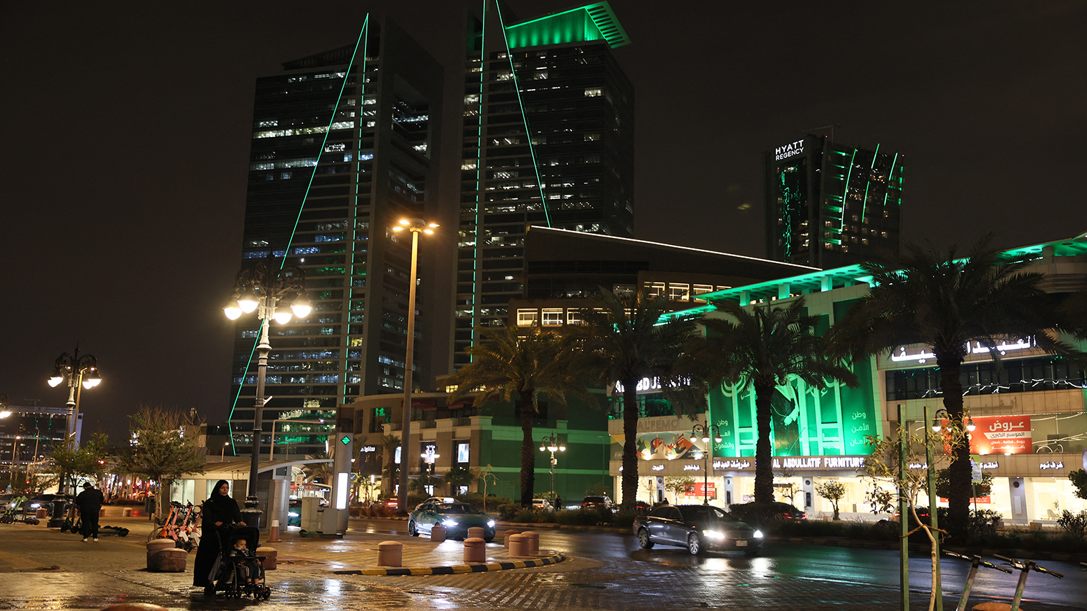 A woman pushes a baby stroller in the Saudi capital Riyadh on March 10, 2026. (AFP)