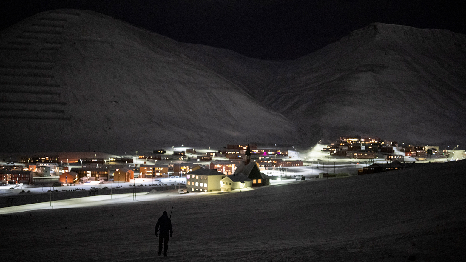 Svalbard Kirke member Lars-Olav Tunheim descends from Plataberget mountain during a hike in Longyearbyen, Norway, Wednesday, Jan. 11, 2023. (AP)
